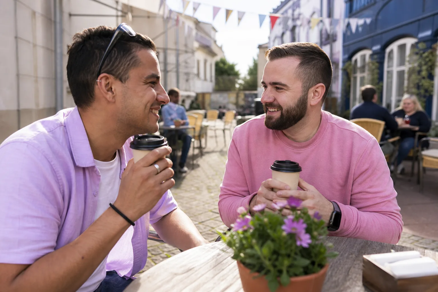 Two men talking beside Exeter Quayside on a sunny afternoon