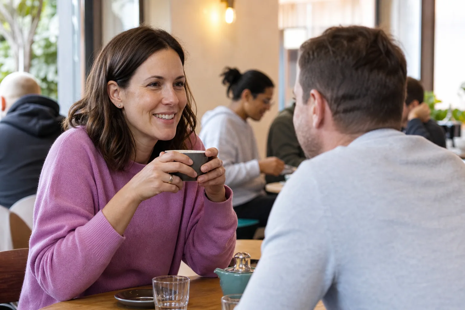 Single parents talking over coffee in central Exeter